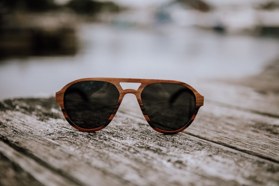 Langley wood sunglasses on the top of woman's head