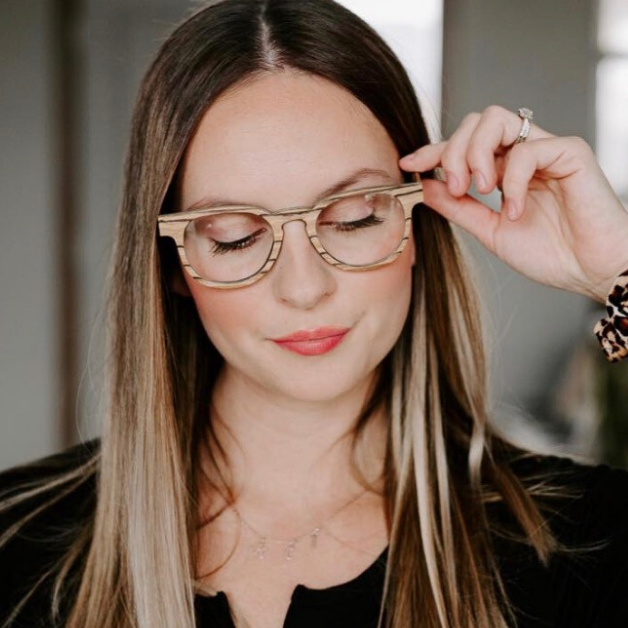woman wearing striped zebra wood eyeglass frames