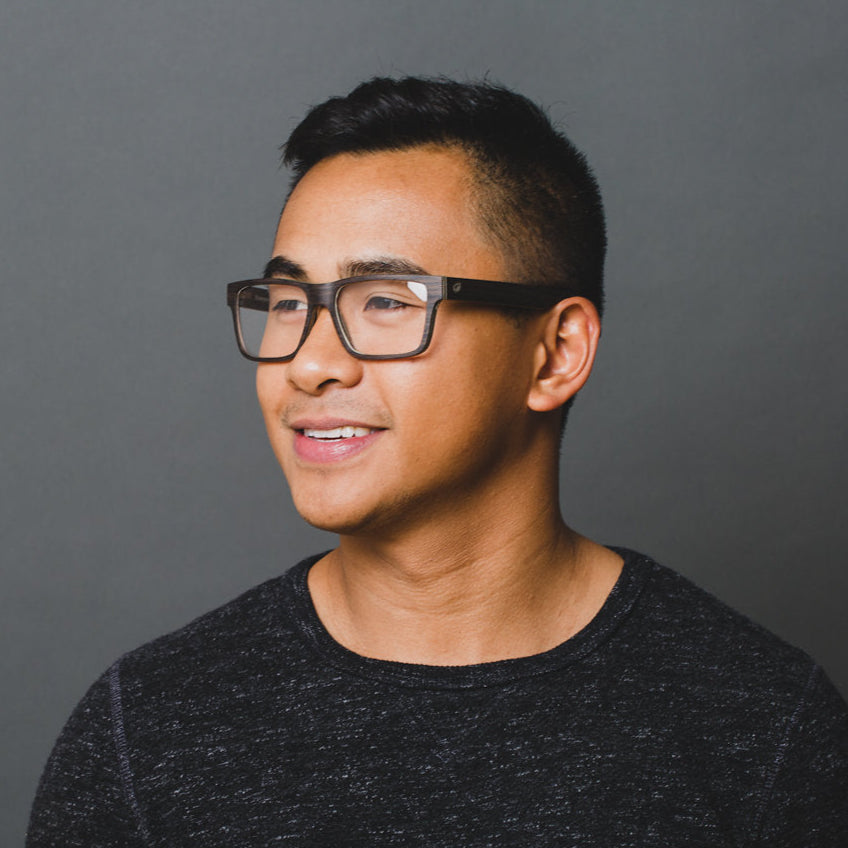 man wearing black wood eyeglasses