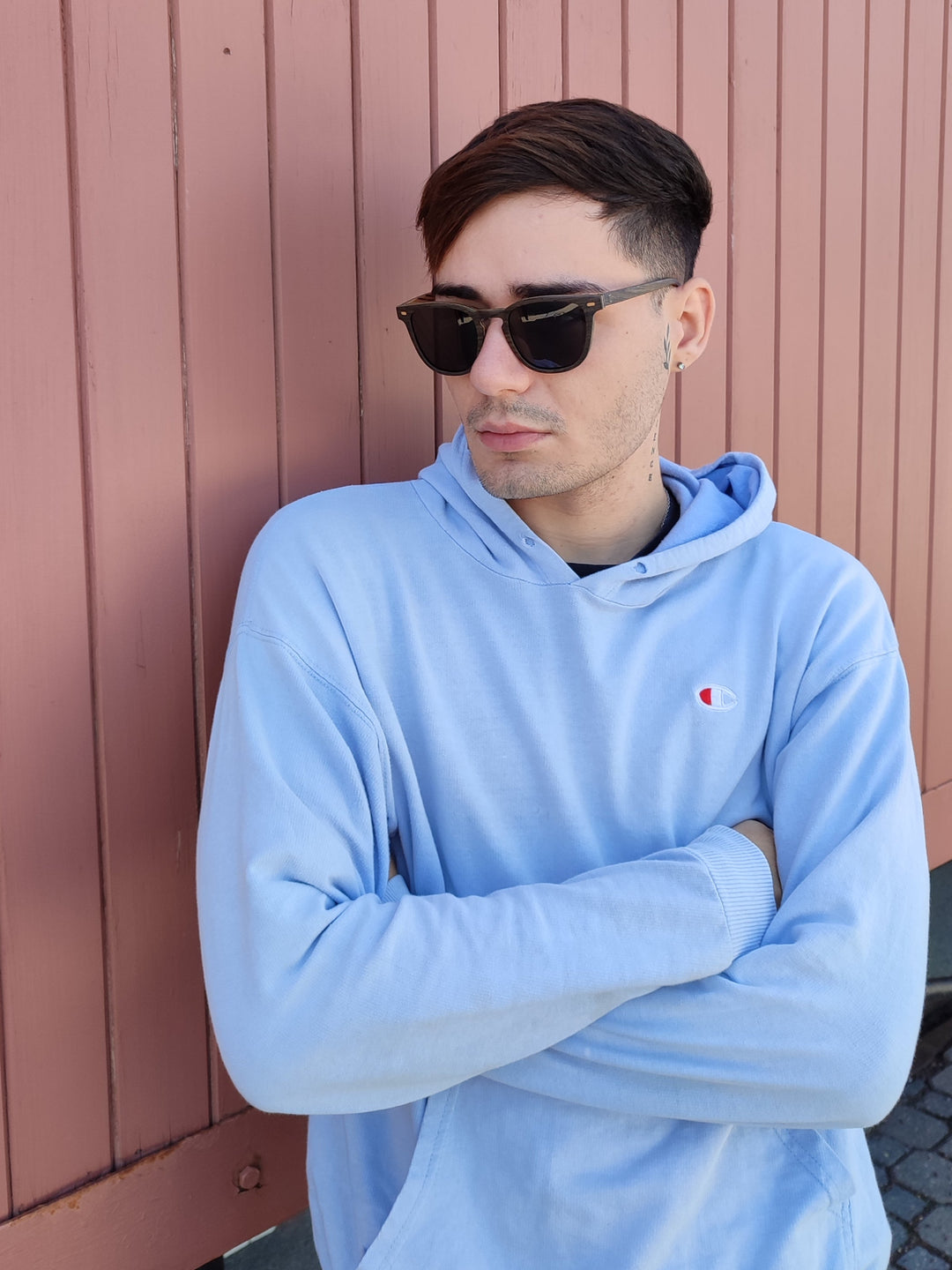 man wearing black oak wood sunglasses. 